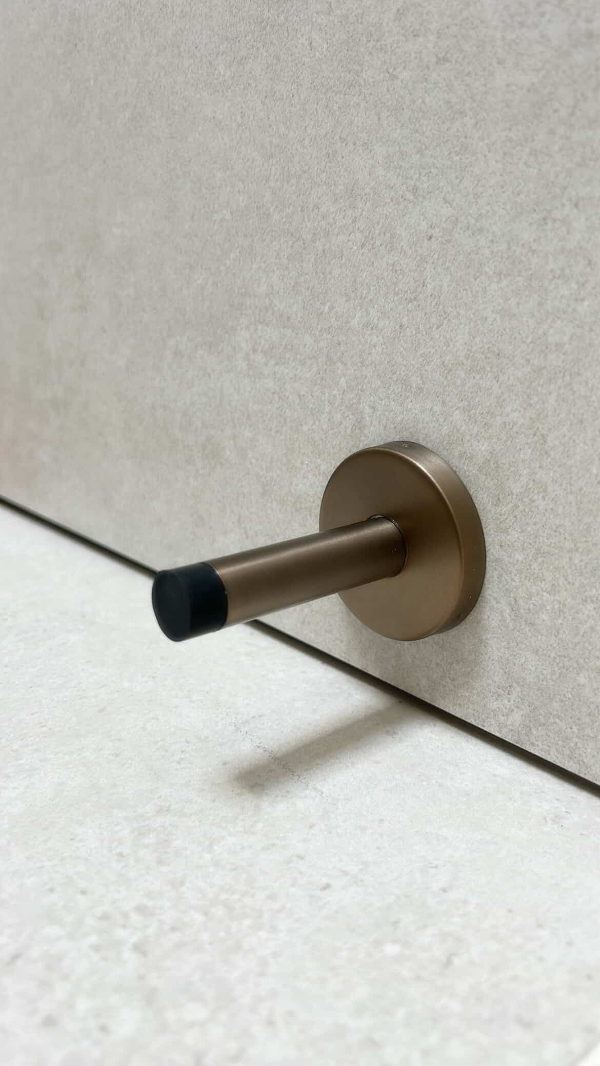 Aged Brass Wall Mounted Straight Door Stop