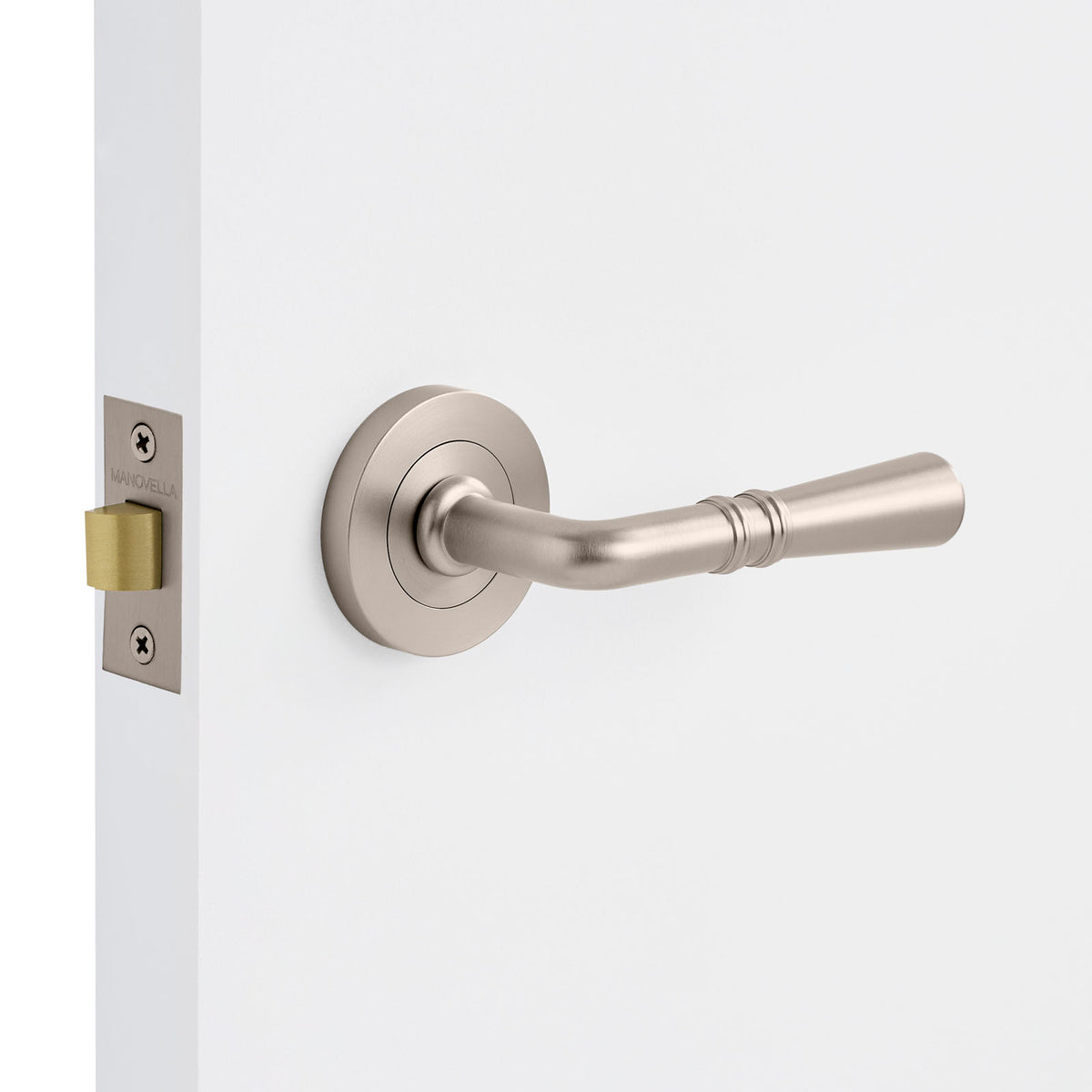 Brushed Nickel door handle on a white door with a visible lock mechanism.