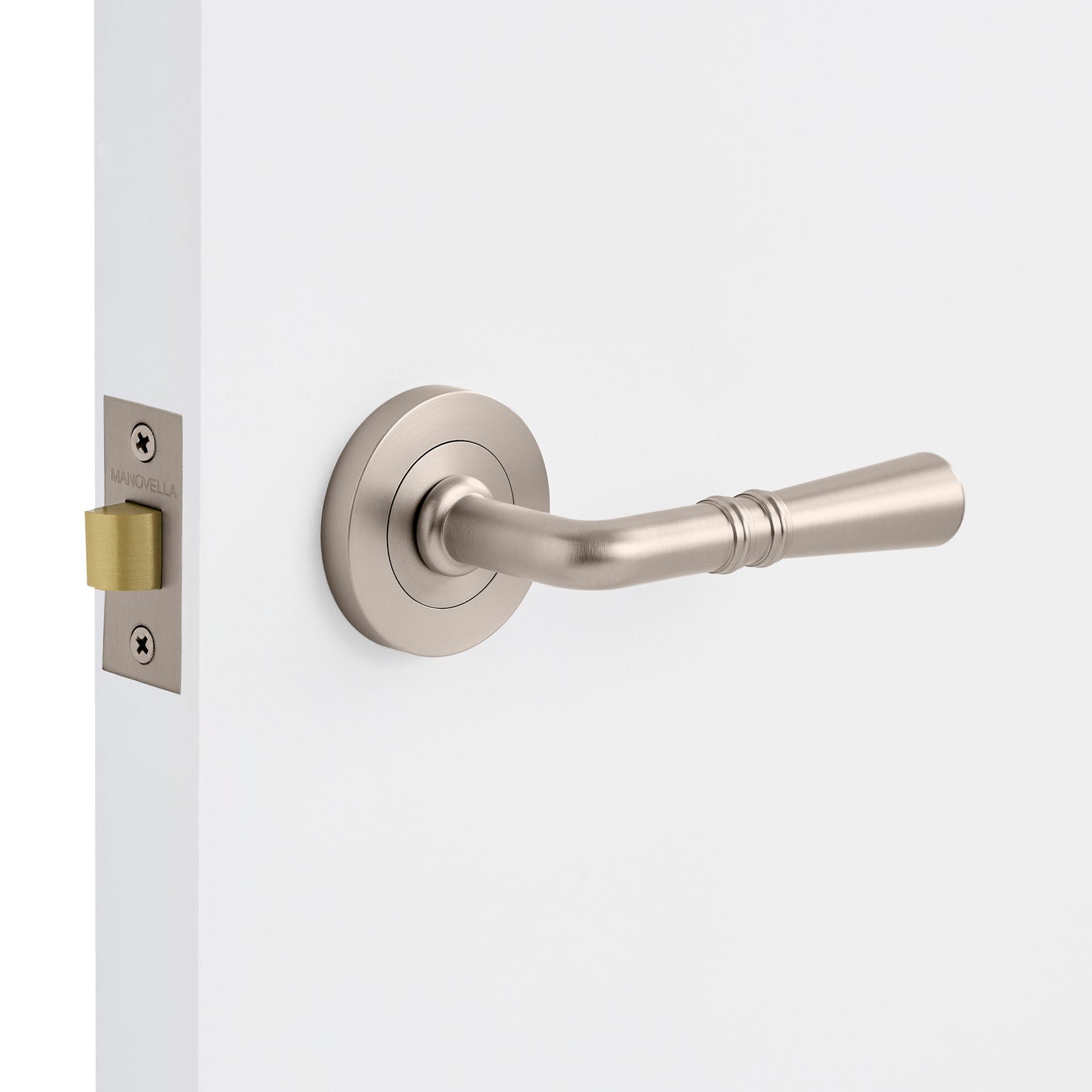 Brushed Nickel door handle on a white door with a visible lock mechanism.