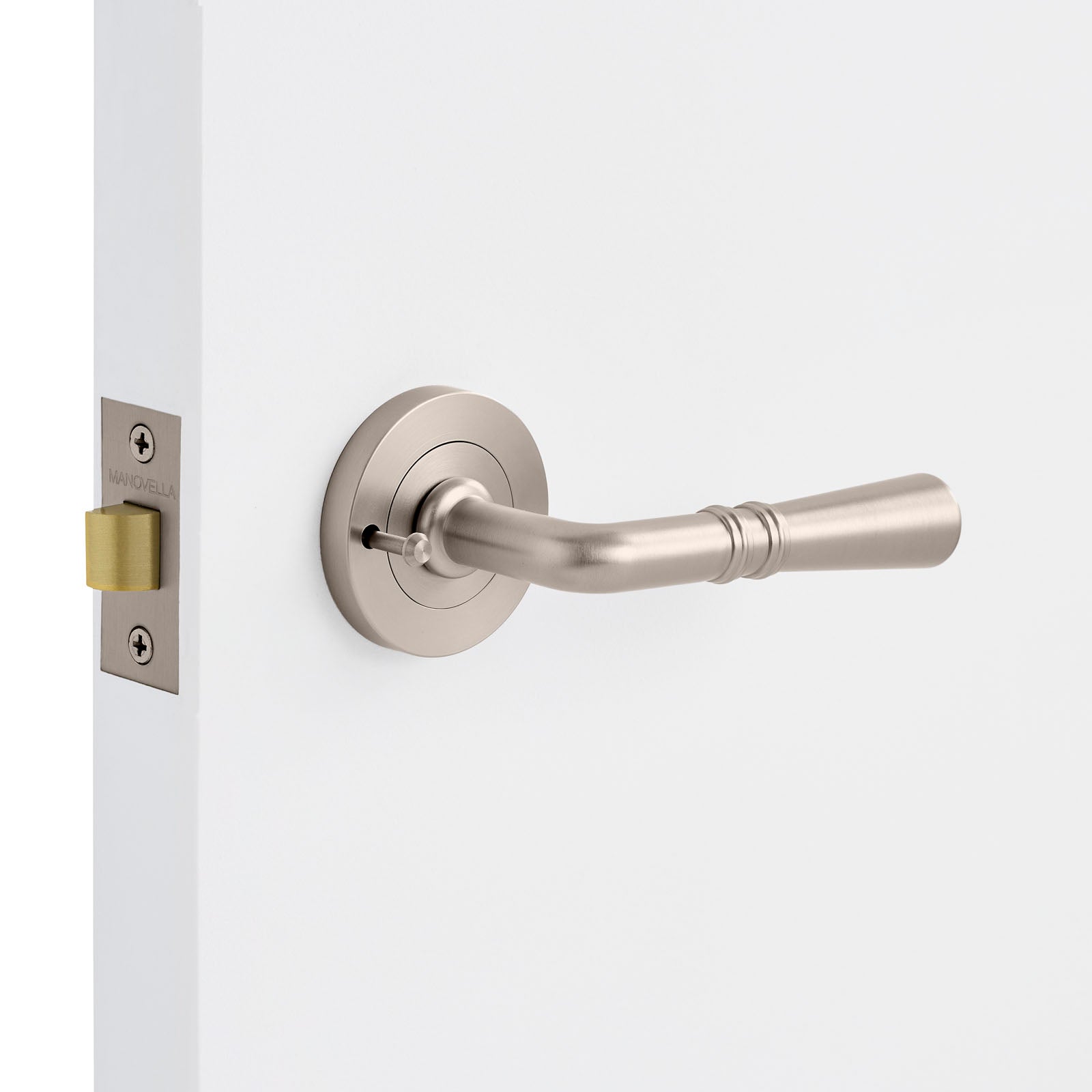 Door handle on a white door with a brushed nickel finish