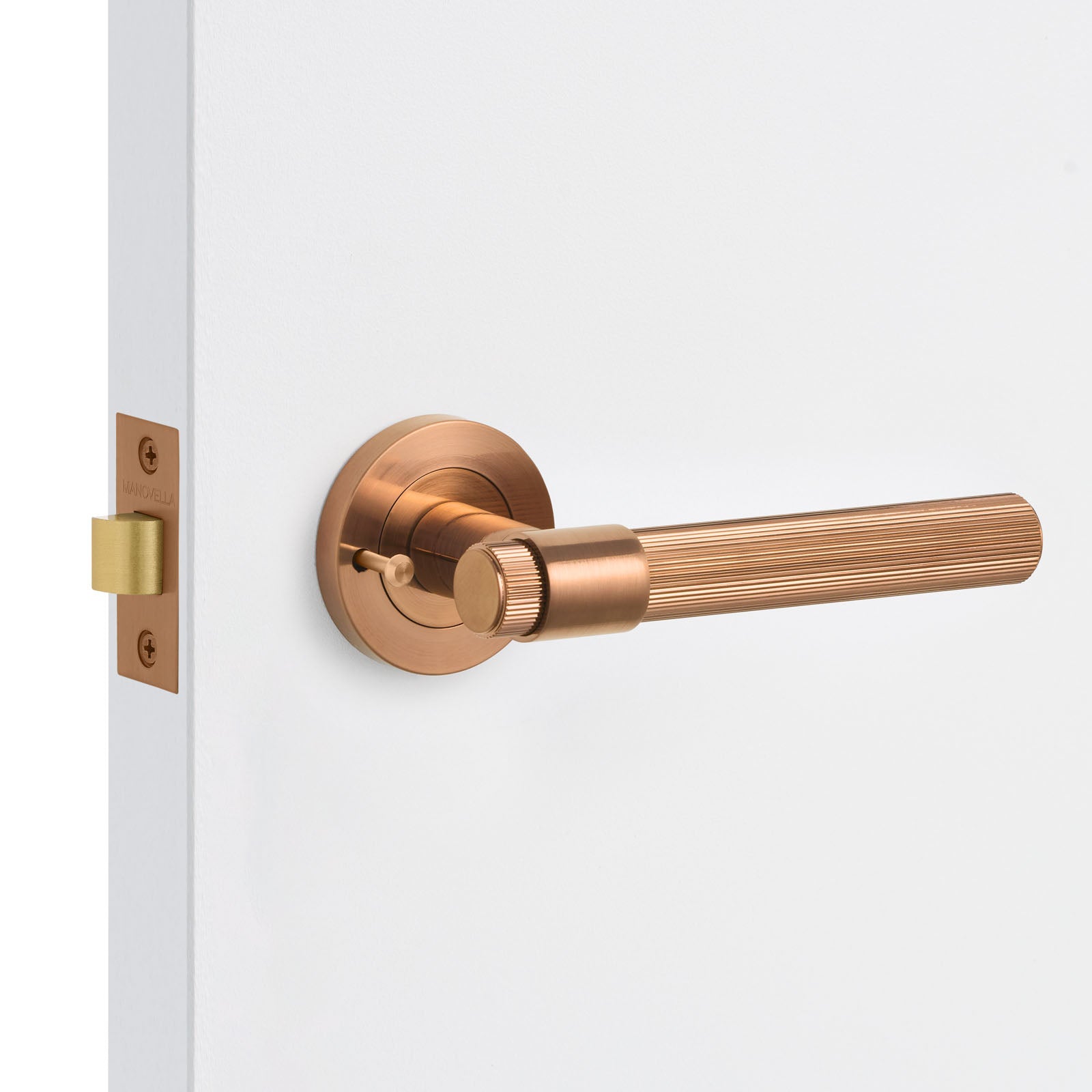 Bronze door handle on a white door