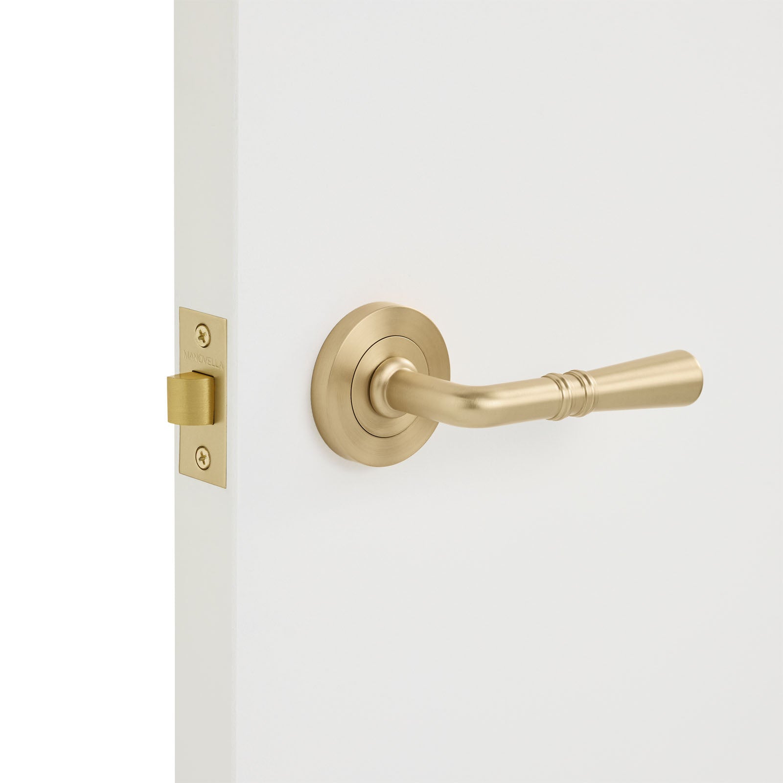 Satin Brass Passage Door Handle Installed on a Door