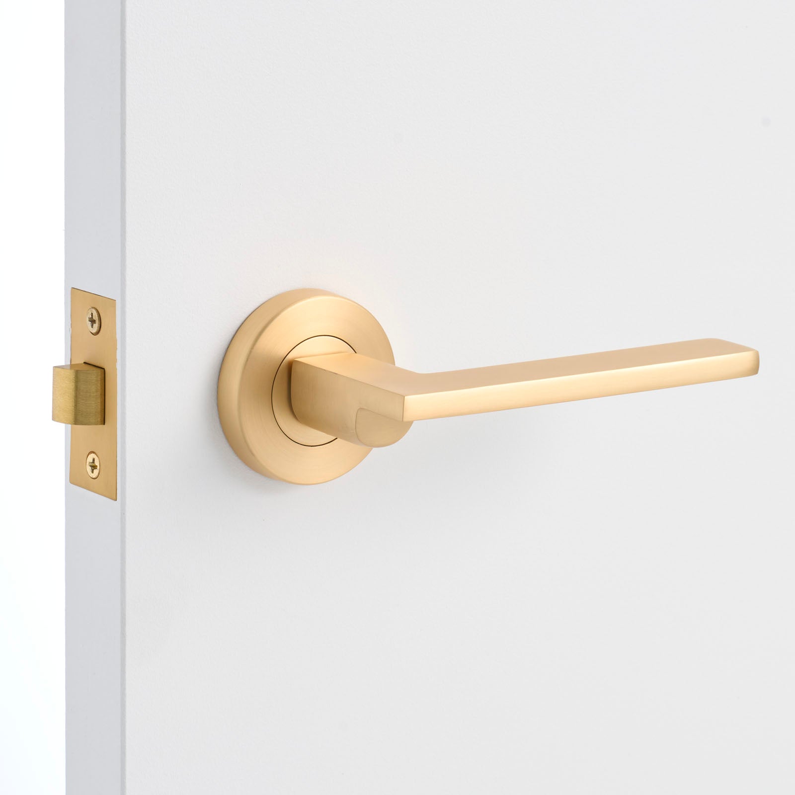 Satin Brass Passage Door Handle Installed on a Door