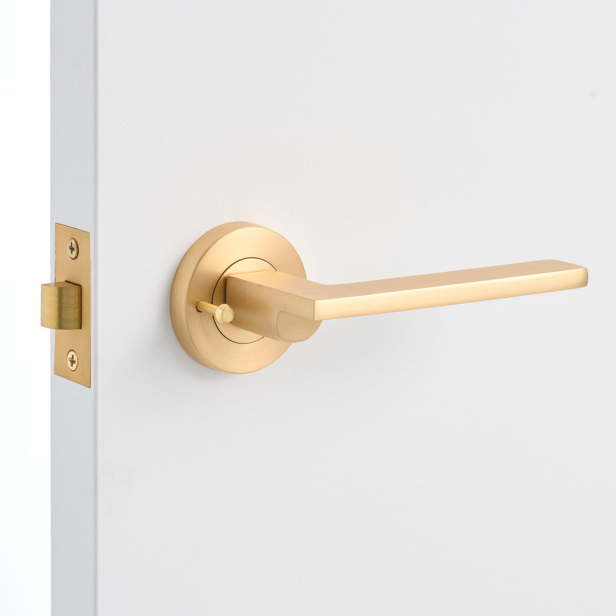 Satin Brass Privacy Door Handle Installed on a Door