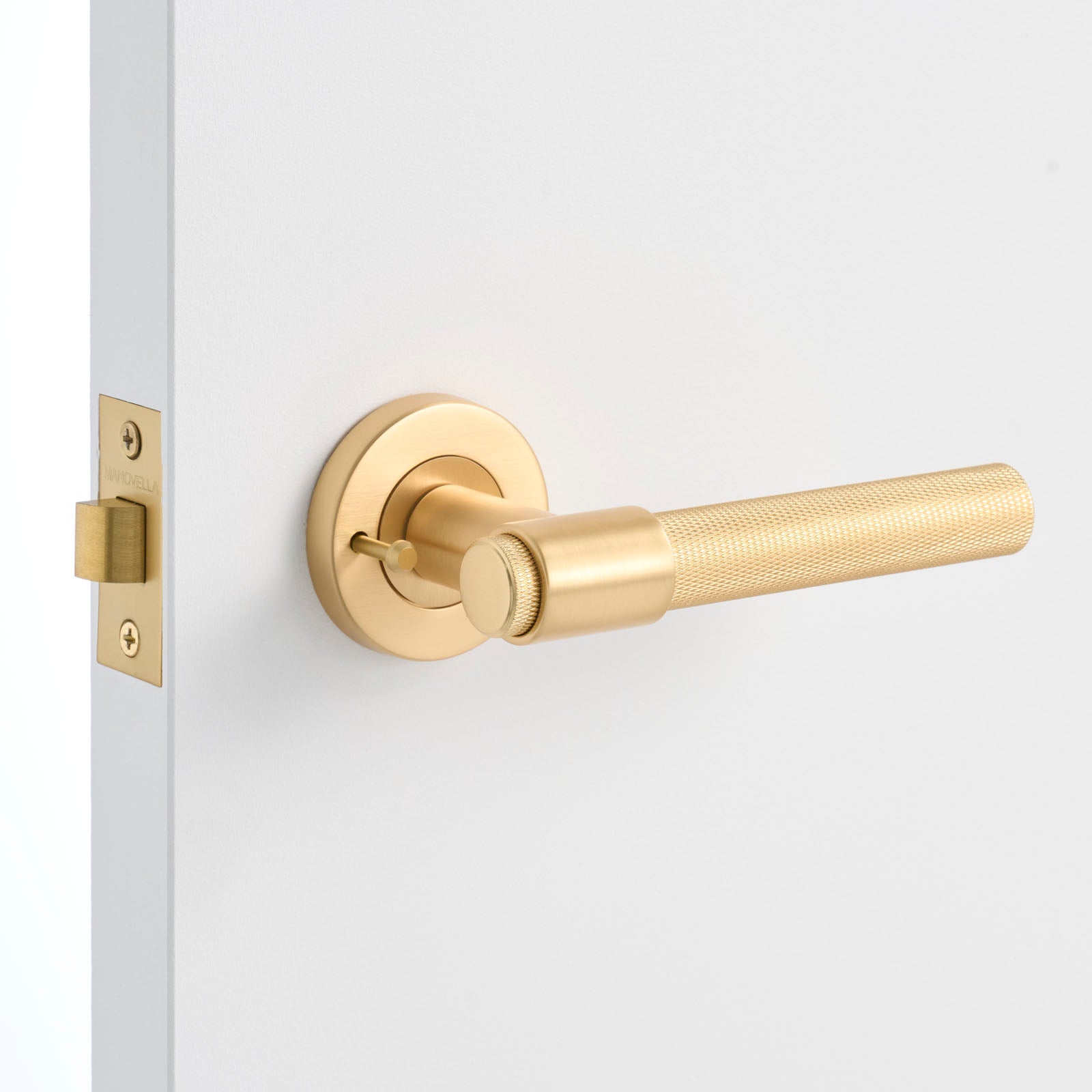 Satin Brass Privacy Door Handle Installed on a Door