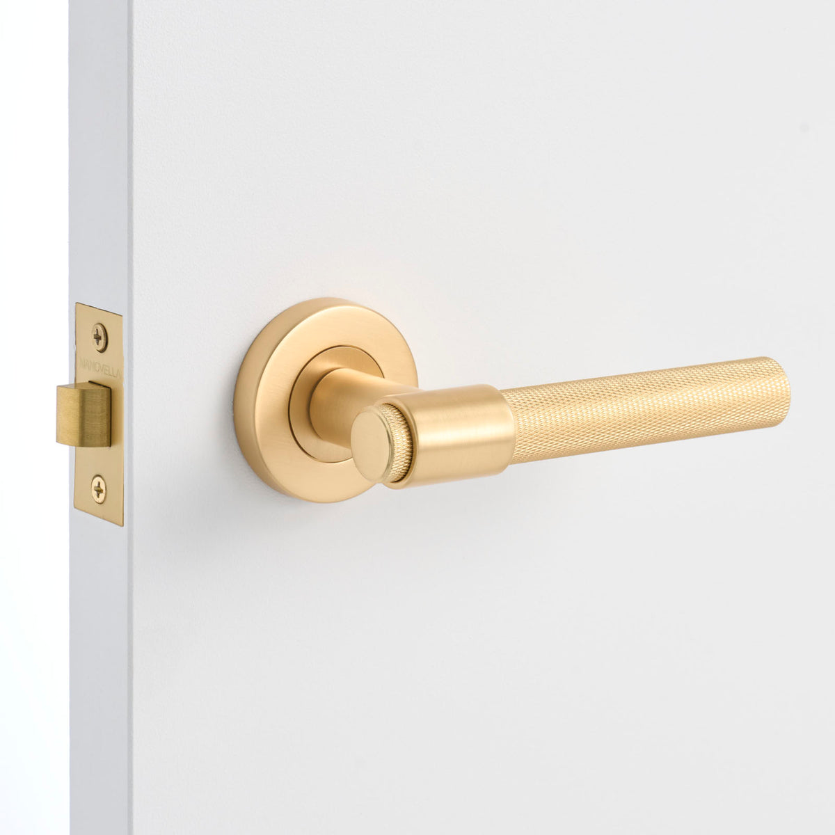 Satin Brass Passage Door Handle Installed on a Door